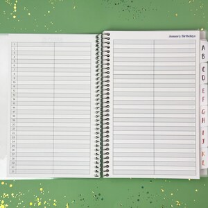 a notebook with a pen on top of it