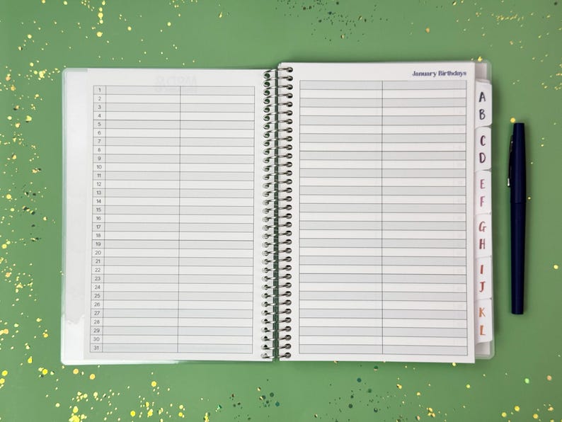 a notebook with a pen on top of it