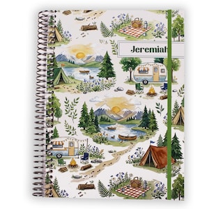 May include: A spiral-bound notebook with a camping-themed design. The cover features a watercolor illustration of a campsite with tents, a camper, a lake, and mountains. The name "Jeremiah" is printed on a green label.