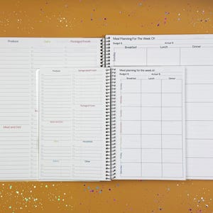 a planner with a pen on top of it