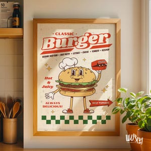 May include: A framed print with a retro-style illustration of a burger character wearing a chef's hat. The print features the text "CLASSIC BURGER" and lists ingredients. The burger character holds a burger box and the words "Hot & Juicy" and "Always Delicious!" are also displayed.