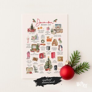 May include: A festive December Bucket List print with watercolor illustrations. The print includes holiday activities like visiting Santa, decorating cookies, and watching movies. A red ornament and pine branch are in the foreground. Text reads "instant download."