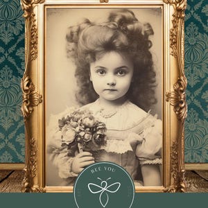 May include: A vintage framed photograph of a young girl with curly hair holding a bouquet of flowers. The photograph is in a gold frame and has a white background. The photograph is surrounded by a green patterned wallpaper. The photograph has a circular sticker with a bee design and the text "Bee You Est 2021 Be Happy 2024".