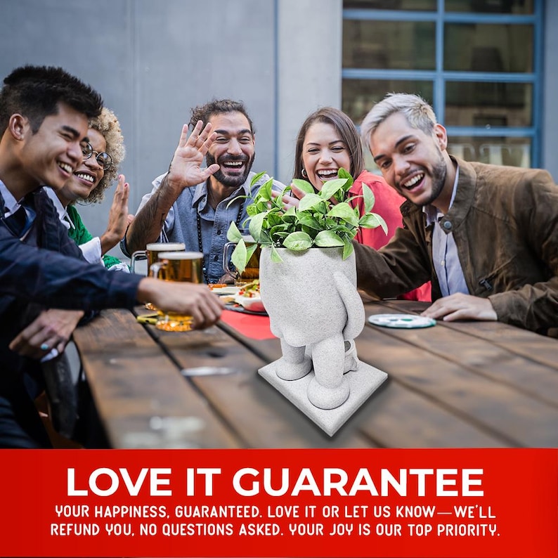 A group of friends enjoying a meal at an outdoor table, laughing and engaging with each other. A quirky planter in the shape of a standing figure with a leafy green plant on top sits in the center, appearing to urinate into a small pot. The humorous design makes it a fun conversation starter. The bold red banner below emphasizes a love-it guarantee, ensuring customer satisfaction with a no-questions-asked refund policy.