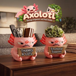 May include: Two pink axolotl-shaped desk organizers. One holds a remote, glasses, and pens, with a sign reading "THANKS A-LOTL". The other holds a green plant and has a sign reading "Emotional Support". The text "Axolotl Storage Organizer and Plant Holder" appears above.