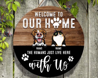 Welcome To Our Home The Humans Just Live Here WIth Us Funny Dog And Cat Wooden Sign Customized Wood Sign Custom Sign Personalized Door Sign