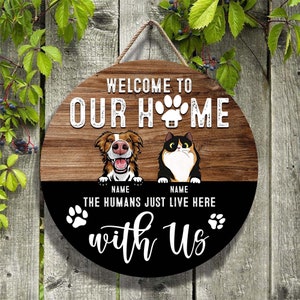 Welcome To Our Home The Humans Just Live Here WIth Us Funny Dog And Cat Wooden Sign Customized Wood Sign Custom Sign Personalized Door Sign