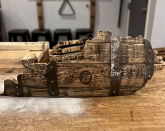 May include: A wooden state of Virginia shaped from a reclaimed whiskey barrel with metal accents. The wood is dark brown and has a rustic look.
