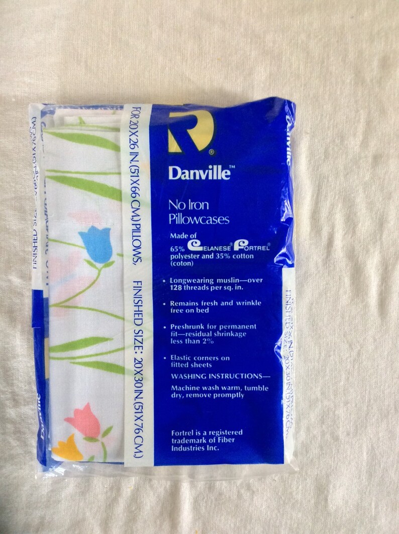 Two vintage standard pillowcases new in plastic danville