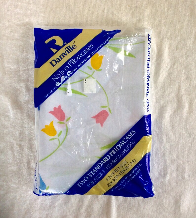 Two vintage standard pillowcases new in plastic danville