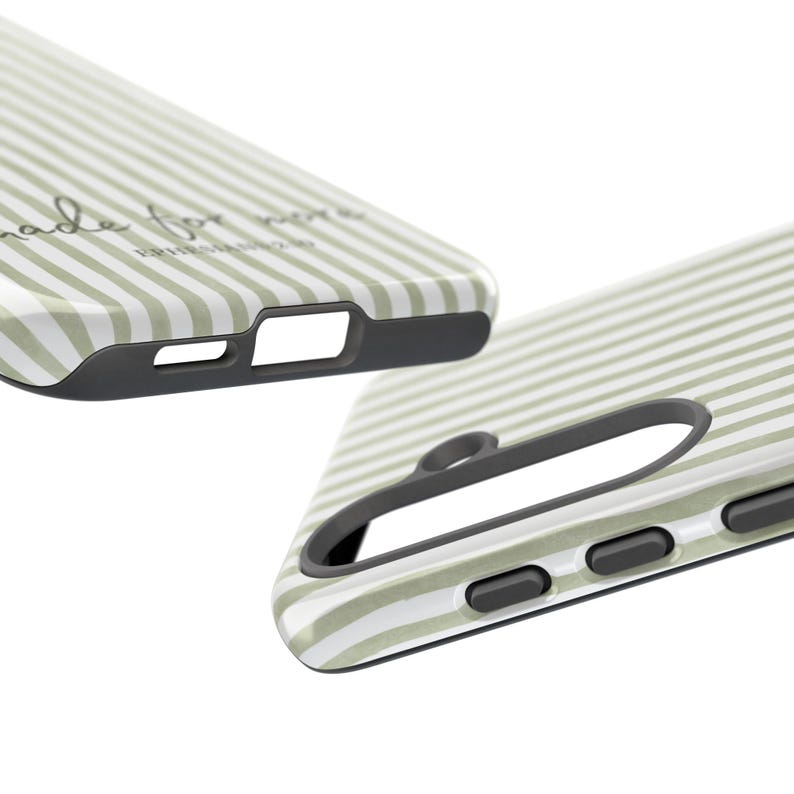 May include: Close-up of two phone cases with a striped pattern in light green and white. The cases have a black border and cutouts for the camera and buttons. The text "made for more" is visible on one case.