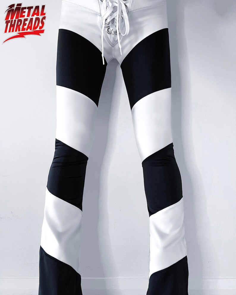 May include: Black and white striped pants with a white lace-up detail at the front.