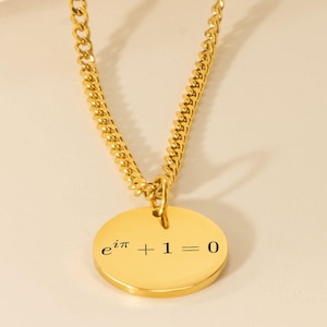 May include: A gold chain necklace with a round pendant featuring the mathematical equation "e^(i*pi) + 1 = 0".