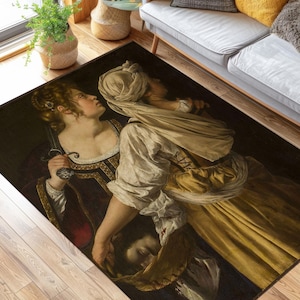 May include: A rug with a dark background featuring a painting of two women in Renaissance-era clothing. The woman on the left is wearing a dark dress with gold accents and the woman on the right is wearing a yellow dress with a white head covering.