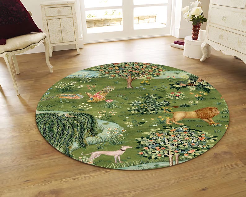 May include: A round green rug with a detailed pastoral scene featuring a lion, a greyhound, trees, and flowers. The rug has a detailed design with a variety of colors, including green, brown, and pink. The rug is placed on a wooden floor.