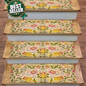May include: Four rectangular stair treads featuring a repeating botanical pattern with yellow tulips, pink flowers, and green foliage on a cream background. The treads are installed on wooden stairs with white risers, and a green best seller badge.