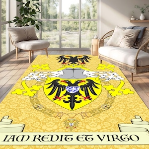 May include: A yellow area rug featuring a heraldic design with a double-headed black eagle on a yellow shield. The rug has a floral pattern background and the Latin phrase "IAM REDIT ET VIRGO" is displayed on a banner.