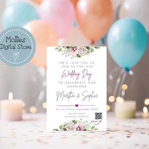 May include: A white wedding invitation with floral accents. The invitation reads "We'd love you to join us for our Wedding Day to celebrate our marriage Martha & Sophie on the 12th of December 2024 The Ritz Hotel Blackhall, R99922 RSVP".