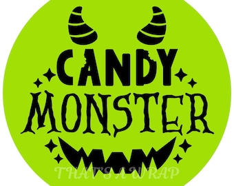May include: A round, lime green graphic with a black monster face design. The text "CANDY MONSTER" is in the center, with a bite taken out of the "Y". The words "THAT'S A WRAP" and "DECOR" are at the bottom.