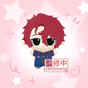 May include: A plush doll with short, messy dark red hair and large black eyes, wearing a blue soccer jersey with red and white accents, the number 9, and a small emblem. A red rectangular box contains the text 監修中 confirming.