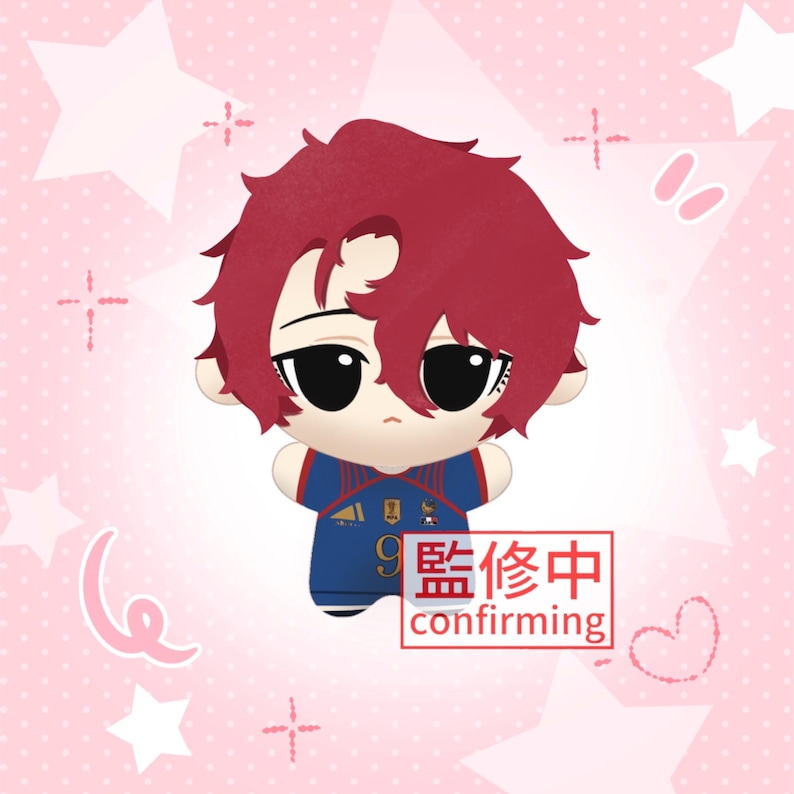 May include: A plush doll with short, messy dark red hair and large black eyes, wearing a blue soccer jersey with red and white accents, the number 9, and a small emblem. A red rectangular box contains the text 監修中 confirming.