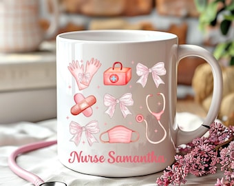 May include: White ceramic mug with a pink design featuring medical symbols like a stethoscope, bandages, and a first aid kit. The mug has the text "Nurse Samantha" printed on the bottom.