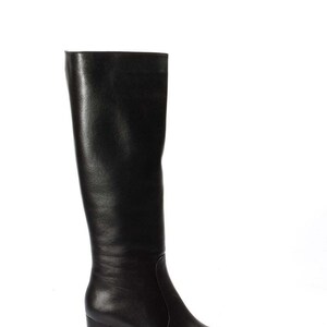 May include: Black leather knee-high boots with a block heel.