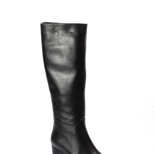 May include: Black leather knee-high boots with a block heel.