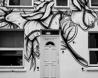 Photograph Black and White Floral Graffiti Design on Door and Building Facade Art Print Home Decor