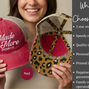 May include: A red trucker hat with a mesh back and the white text Made for More EPHESIANS 2:10 on the front. The interior of the hat features a brown and black leopard print pattern. The text Why Choose Us is visible on the right side of the image.