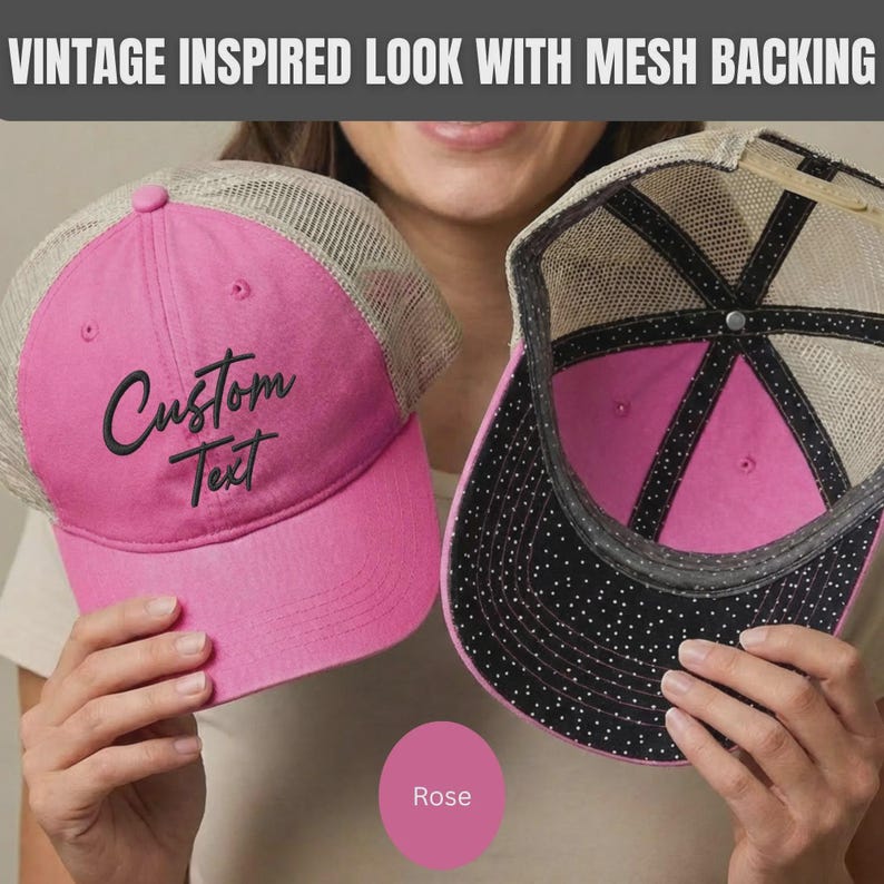 May include: A bright pink baseball cap with a beige mesh back and the words Custom Text embroidered in black on the front. The interior of the cap features a black lining with a white polka dot pattern and a button on the top crown.