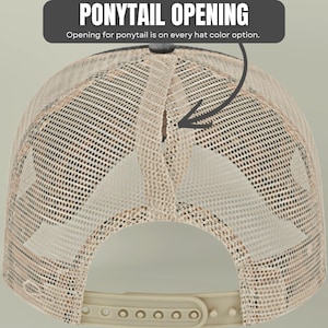 May include: A beige mesh trucker hat featuring a vertical ponytail opening at the back. The text PONYTAIL OPENING and Opening for ponytail is on every hat color option is displayed above the hat with an arrow pointing to the opening.