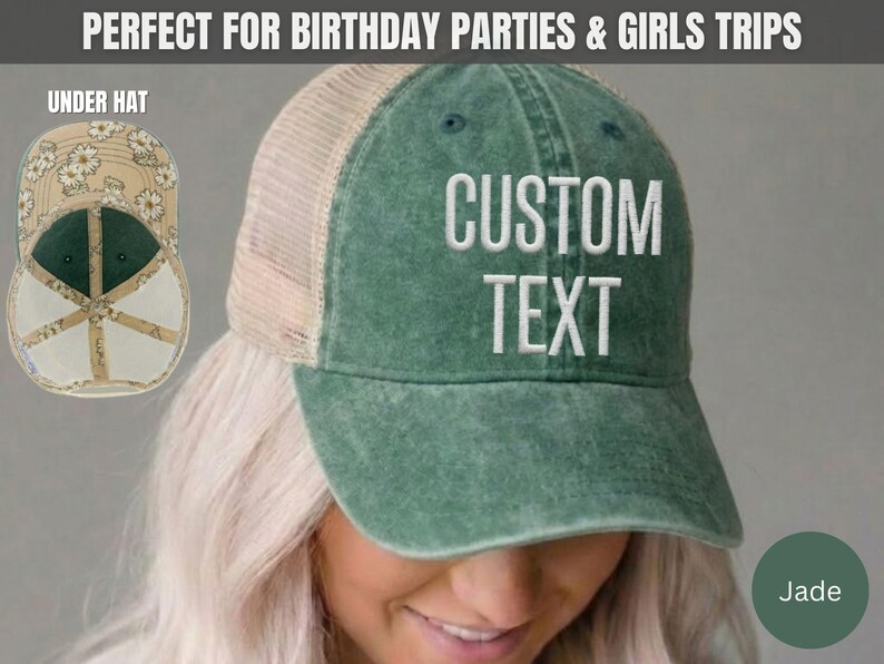 May include: A jade green trucker hat with a mesh back and white embroidered text that reads CUSTOM TEXT. The underside of the brim features a beige and white daisy floral pattern. The hat has a distressed finish and a structured front panel.