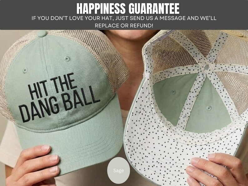 May include: A sage green trucker hat with a mesh back and the black embroidered text HIT THE DANG BALL on the front. The interior of the hat features a white lining with a black speckled pattern along the seams and the underside of the brim.