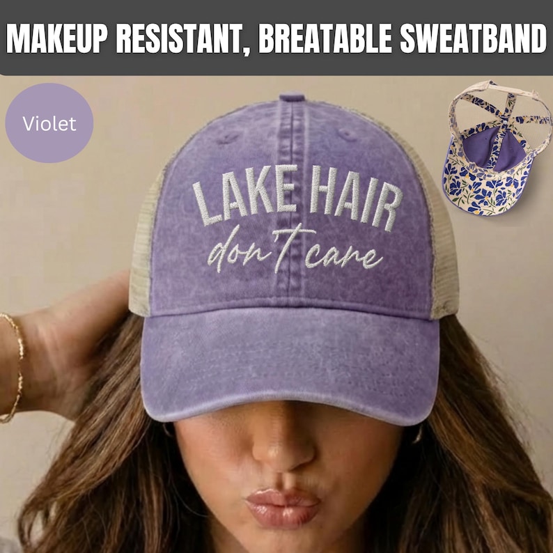 May include: A violet baseball cap with a mesh back and the embroidered white text "LAKE HAIR don't care" on the front. The cap features a makeup resistant, breathable sweatband and a rear opening with a floral patterned interior lining.