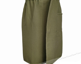 May include: A green waffle weave wrap skirt with a black elastic waistband and a side pocket.