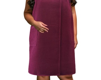 May include: A burgundy waffle weave bath wrap with a wrap-around style and a single pocket on the side.