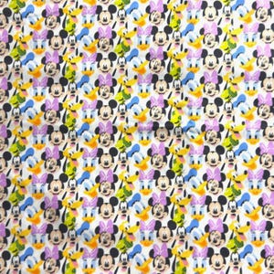 May include: White fabric featuring a repeating pattern of Mickey Mouse, Minnie Mouse, Donald Duck, and Daisy Duck. The characters are in various colors, including black, yellow, purple, and blue. The design is suitable for children's apparel or craft projects.
