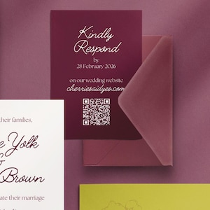 May include: A burgundy wedding invitation with the text "Kindly Respond" and a QR code. The invitation includes the date "28 February 2026" and the website cherriesaidyes.com. An envelope is partially visible.