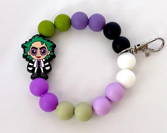 Pulsera llavero de Tim Burton de Beetlejuice para uso diario o para regalar en Halloween.