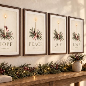May include: A set of four framed wall art prints featuring illustrations of single lit candles surrounded by pine branches and red berries. Each print displays a word: HOPE, PEACE, JOY, and LOVE, along with a corresponding Bible verse citation.
