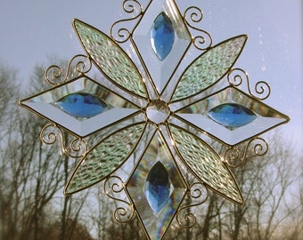 Winter snowflake.  bevels and blue gems.