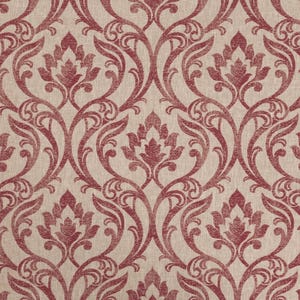 May include: A close-up of a fabric with a repeating damask pattern. The design features a light beige background with a deep red floral and scroll motif. The pattern is symmetrical, with stylized flowers and curved lines.