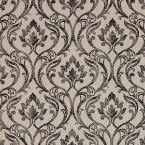 May include: Close-up of a fabric with a repeating damask pattern. The design features dark grey floral motifs and scrolling vines against a light beige background. The pattern is symmetrical and detailed.