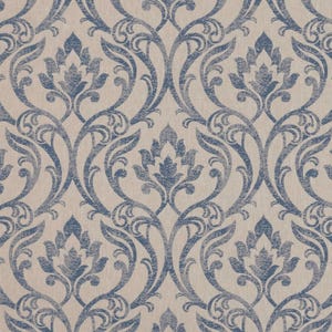 May include: A repeating pattern of blue floral damask designs on a beige background. The design features stylized flowers and scrolling vines, creating a classic and elegant look. The fabric has a textured appearance.