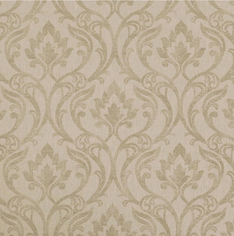 May include: A beige wallpaper with a repeating damask pattern. The design features stylized floral and scroll motifs in a lighter beige, creating a subtle contrast. The background has a textured appearance, giving a classic and elegant feel to the wallpaper.