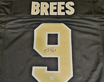 Camisa do New Orleans Saints assinada por Drew Brees, membro do Hall da Fama da NFL, com logotipo da equipe