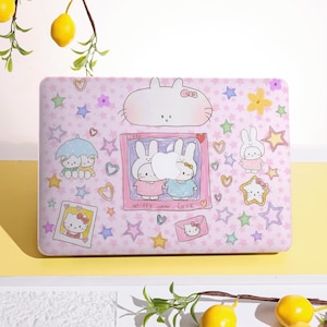 May include: A pink laptop case featuring cartoon illustrations of bunnies, stars, hearts, and flowers. The case has a rectangular shape and includes the text "miffy in love" and a picture of Hello Kitty.