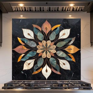 May include: A black marble backsplash with a floral design in shades of orange, teal, white, and gold. The backsplash is installed above a stainless steel gas range in a modern kitchen setting.