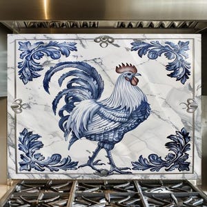 May include: A decorative kitchen backsplash featuring a blue and white rooster design. The rooster is centered on a marble-patterned background, framed by blue floral accents. The backsplash is installed behind a stainless steel gas range.